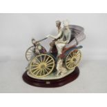 Lladro - A very large, limited edition porcelain group depicting a couple in an early motor vehicle,