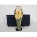Moorcroft Pottery- a tall modern vase tubelined and hand painted in nthe windrush pattern,