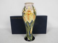 Moorcroft Pottery- a tall modern vase tubelined and hand painted in nthe windrush pattern,