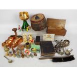 A mixed lot of collectables to include plated flatware, musical trinket box, musical goblet, treen,