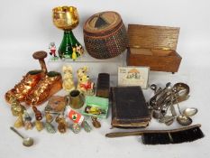 A mixed lot of collectables to include plated flatware, musical trinket box, musical goblet, treen,