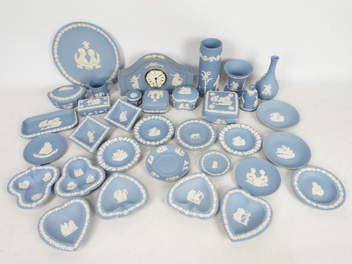 Wedgwood - A collection of blue Jasperware to include vases, mantel clock, trinket boxes,