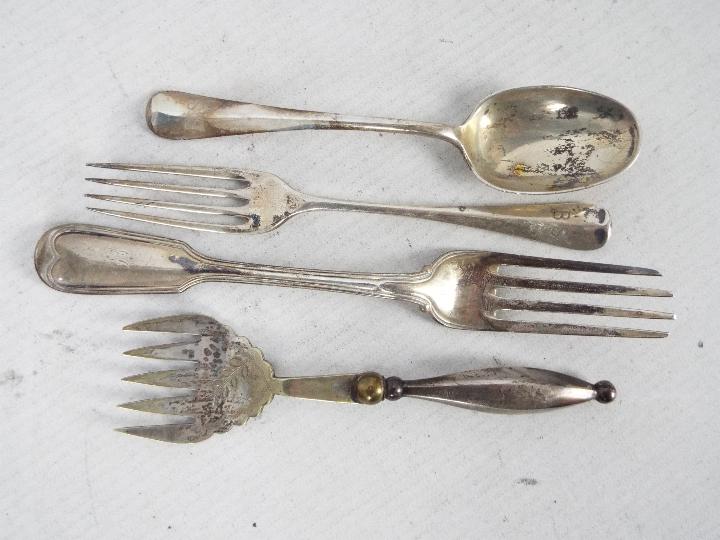 Four pieces of hallmarked silver flatware, Victorian and later to include two forks,