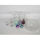 A collection of glassware to include Caithness vases and paperweights,