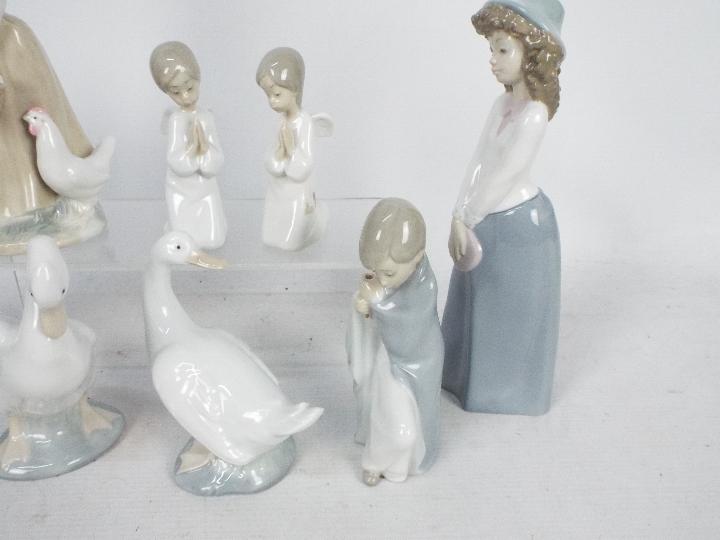 A collection of Lladro and Nao figures, largest approximately 24 cm (h). - Image 4 of 5