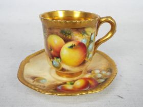 A Royal Worcester, fruit decorated cup and saucer,