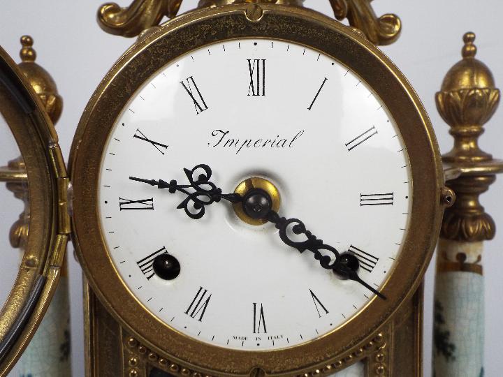 An Italian gilt brass and ceramic clock garniture, signed to the dial Imperial, - Image 2 of 10