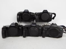 Photography - A collection of Canon camera bodies comprising three EOS650, one EOS630 and an EOS600.