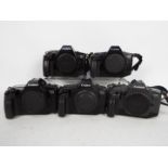 Photography - A collection of Canon camera bodies comprising three EOS650, one EOS630 and an EOS600.