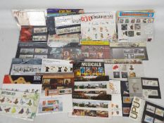 Philately - A collection of Royal Mail Mint Stamp Presentation Packs and first day covers,