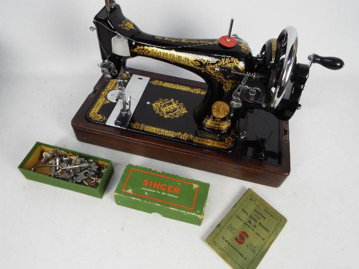 A Singer Sewing Machine in polished mahogany hood with functioning lock and key, - Image 2 of 3