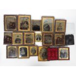 A collection of antique, predominantly framed, photographs,