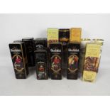 A collection of vintage whisky presentation tins / tubes, all empty,