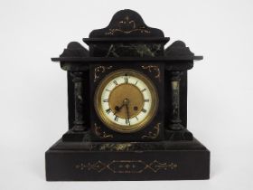 A black slate and green marble mantel clock of architectural form,