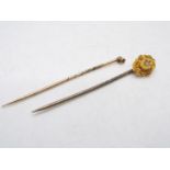 15ct gold - A yellow metal , stone set stick pin and one further example, stamped 15ct,