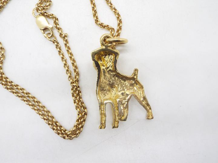 A 9ct gold pendant in the form of a boxer dog on a 9ct gold necklace, 44 cm (l), approximately 12. - Image 3 of 3