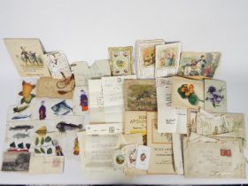 A collection of mixed ephemera to include Christmas / greeting cards, fabric book,