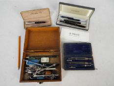 A Parker 88 fountain pen, a Parker 51 propelling pencil, technical drawing set and similar.