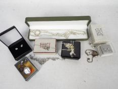 A collection of silver and white metal jewellery to include necklaces (longest 50 cm), locket,