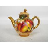 A Royal Worcester, fruit decorated, miniature teapot,