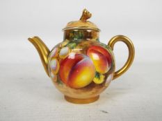 A Royal Worcester, fruit decorated, miniature teapot,