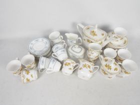 A collection of tea wares comprising Spode Austen pattern and Royal Doulton Laureate.