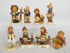 Eight Goebel / Hummel figures, largest approximately 11 cm (h).