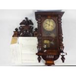 A small wall mounted Vienna style clock, walnut case with opening,