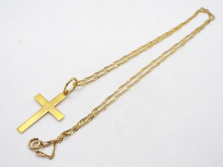A 9ct yellow gold crucifix on 9ct yellow gold chain, 48 cm (l), approximately 2.9 grams.