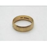 A 9ct gold wedding band, size K, approximately 2.9 grams.