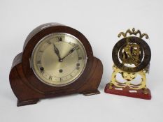An oak cased mantel clock and a brass skeleton clock.