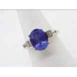 14 k - A white metal, diamond and tanzanite ring with a central,