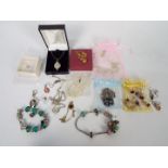 A mixed lot of costume jewellery to include necklaces, earrings, ring,