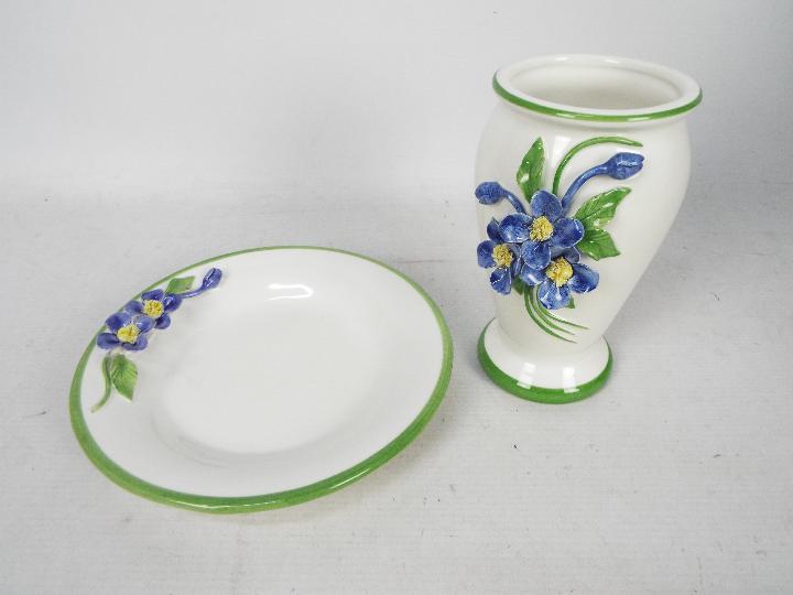 An Italian ceramic dish and vase with applied floral decoration, vase approximately 17 cm (h).