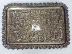 A Victorian silver tray with scrolling repousse decoration, Chester assay 1900,
