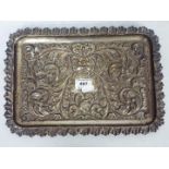 A Victorian silver tray with scrolling repousse decoration, Chester assay 1900,