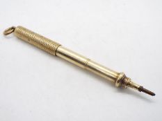 A yellow metal slider propelling pencil by Sampson Mordan & Co, stamped with arrow mark for 10ct,