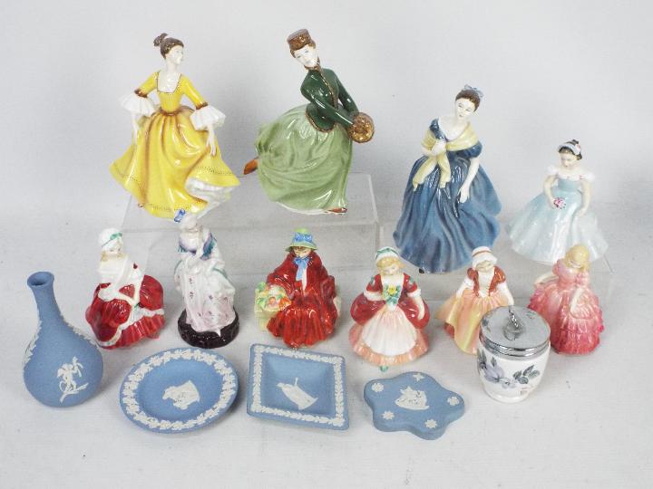 A collection of ceramics to include Wedgwood Jasperware, Royal Doulton lady figures and similar,