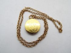 An interesting locket, the front hinged face formed from a George III spade guinea, 1788,