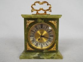 Elsinor - A Swiss 8 day mantel or desk clock, onyx, gilt mounted case, approximately 17 cm (h).