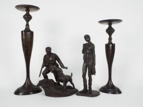 Two Heredities bronze resin figures,