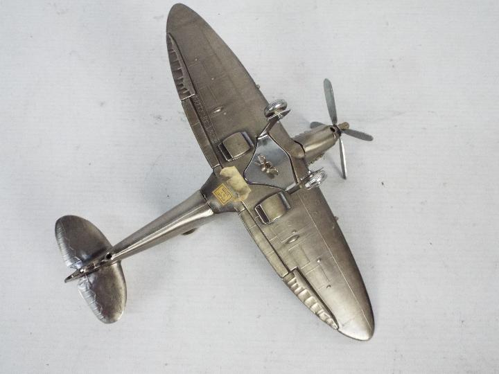 A novelty table lighter in the form of a Supermarine Spitfire Mk IX, 20 cm (l). - Image 5 of 6