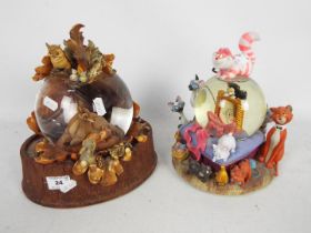 Disney - Two Disney snow globes comprising Bambi and The Aristocats, approximately 24 cm (h).