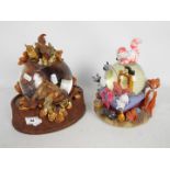 Disney - Two Disney snow globes comprising Bambi and The Aristocats, approximately 24 cm (h).