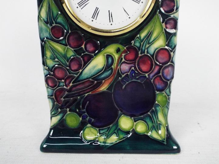 Moorcroft Pottery- a clock, tube lined and hand painted with finch and berries decoration, - Image 4 of 8