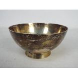 A George V silver footed bowl of simple form, London assay 1922, sponsors mark for Charles Edwards,