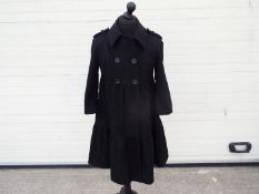 Betty Jackson black - a Betty Jackson black wool three quarters length jacket,