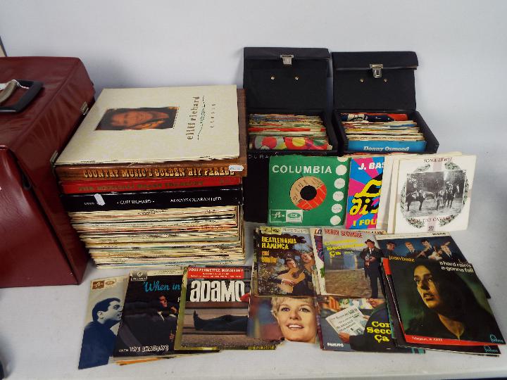 Three cases of vinyl records, 12" and 7", to include The Beatles, Duran Duran, Jona Lewie,