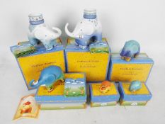 A collection of Goebel Elephant Romance figures by Linda Edwards, contained in original boxes.