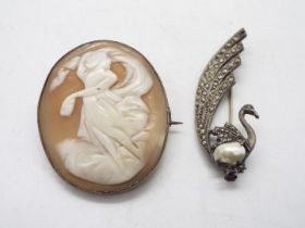 A white metal, French brooch in the form of a bird,